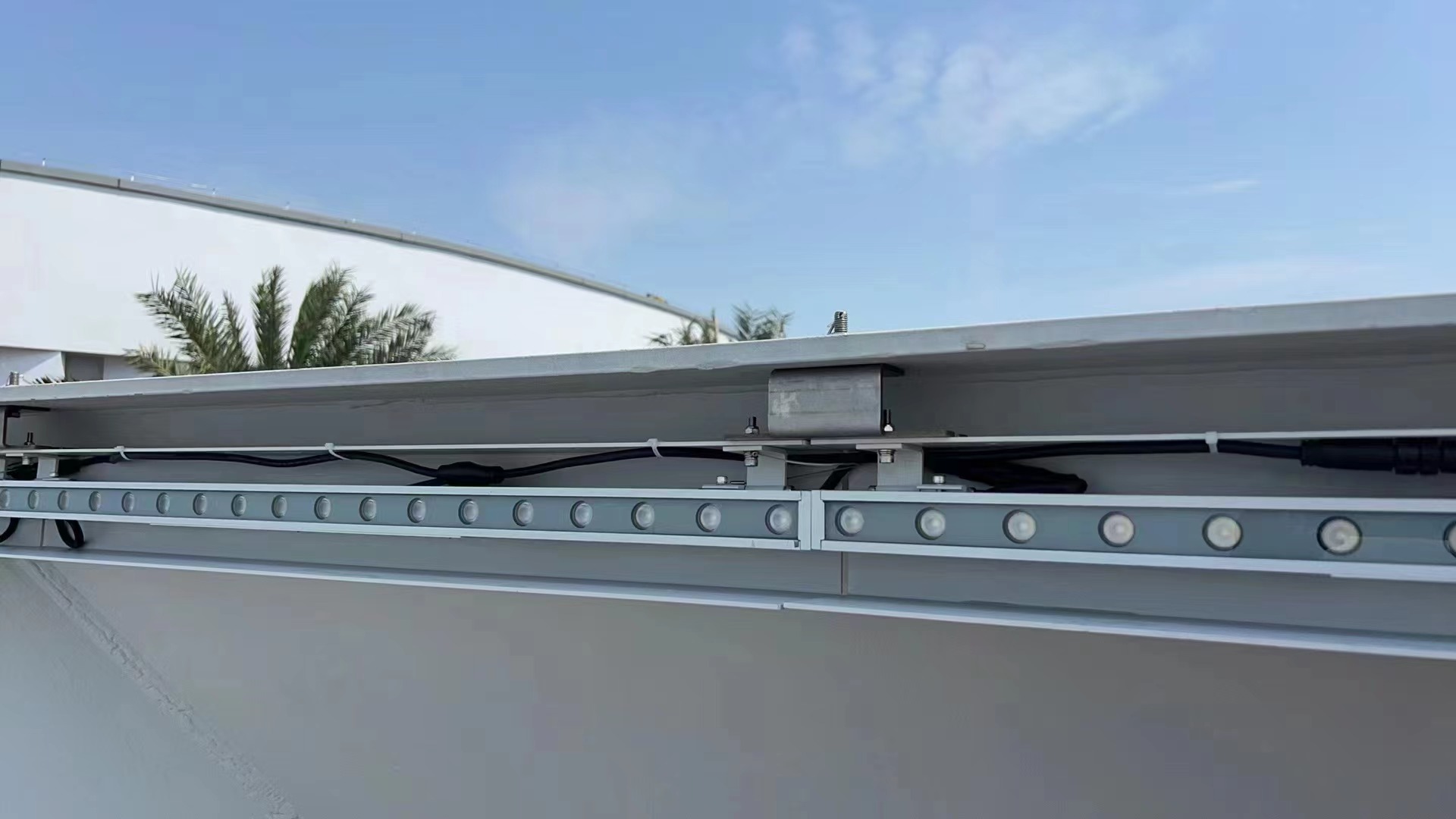 Outdoor LED wall washer bracket with adjustable mounting angle and stainless steel fixing bolts for precise façade illumination