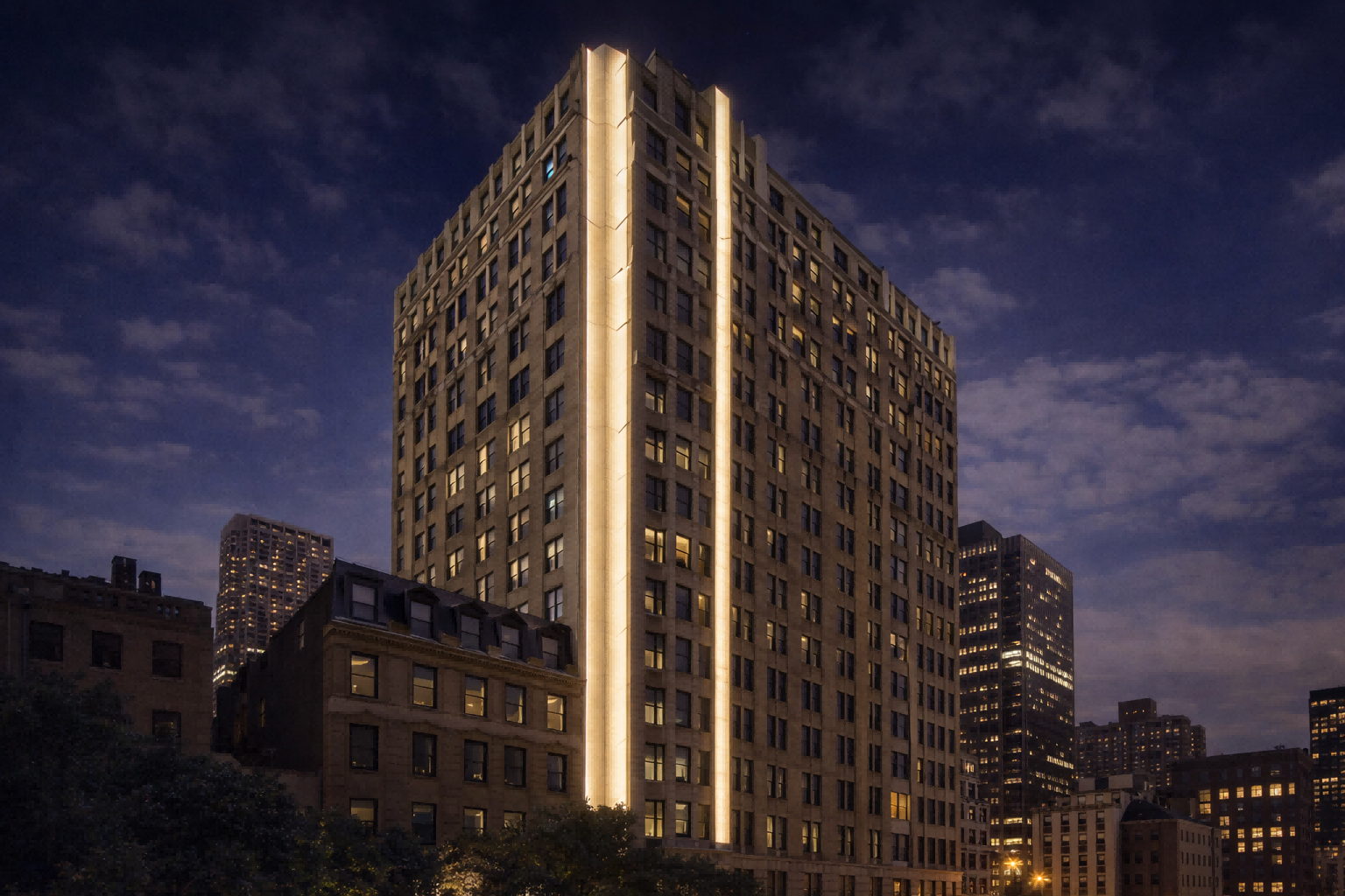 Vertical outdoor linear LED lighting highlighting architectural lines of a high-rise building facade at night