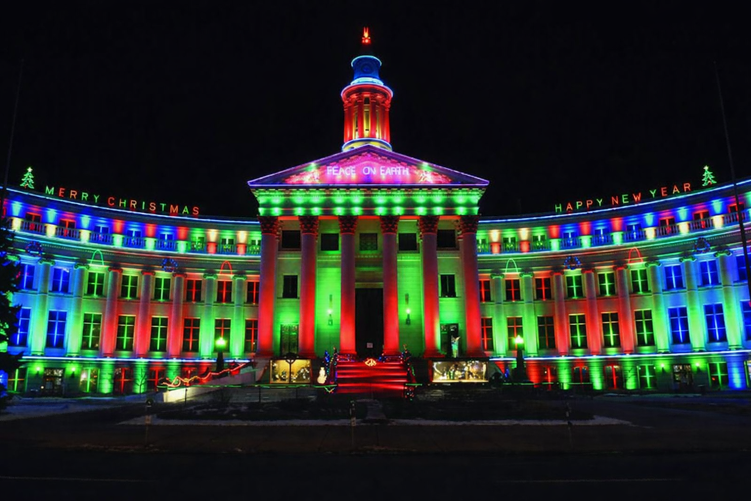 Colorful building illuminated with Christmas and New Year LED lights at night