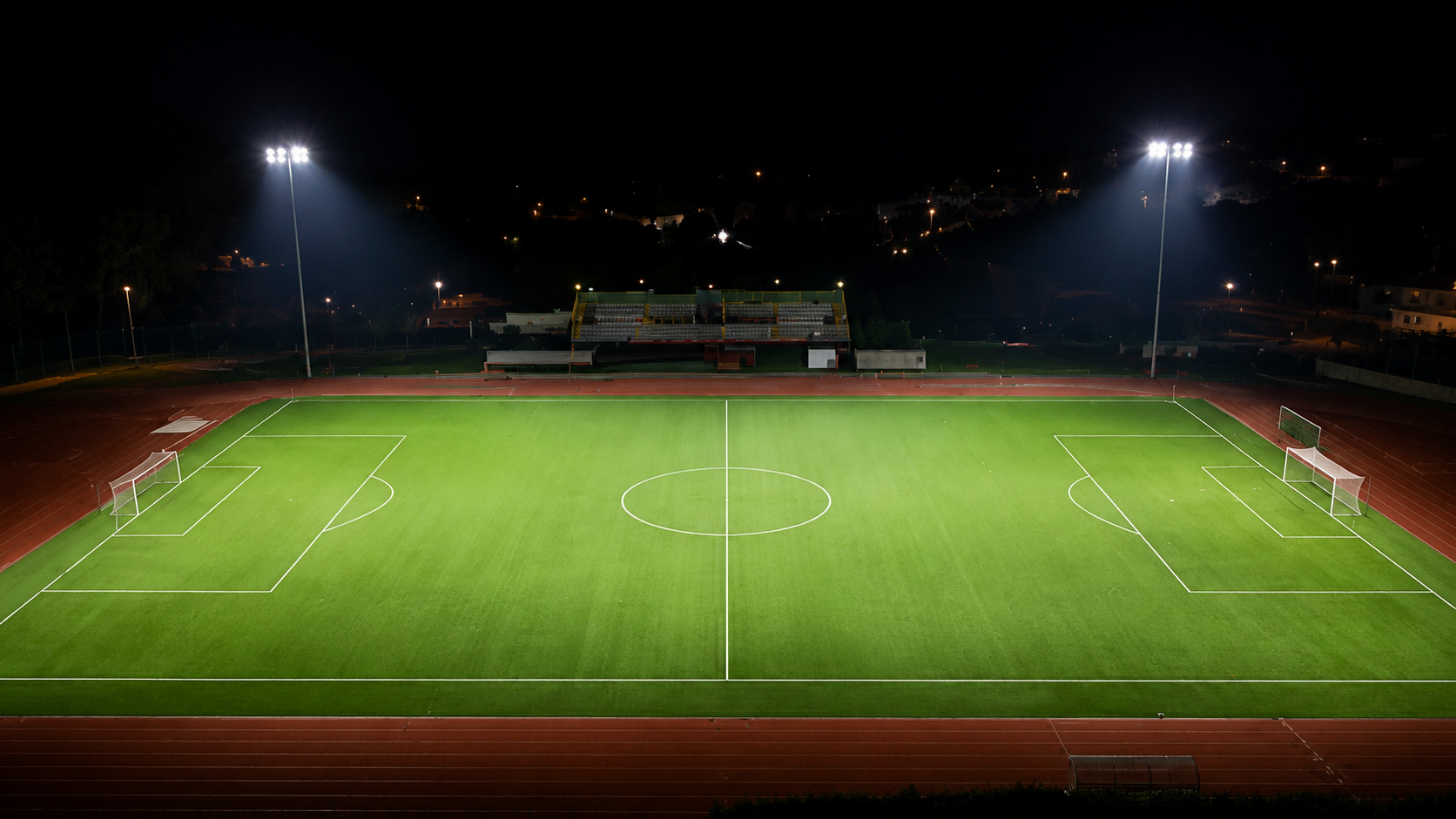 High-uniformity sports stadium illumination with rectangular beam distribution to reduce spill light.