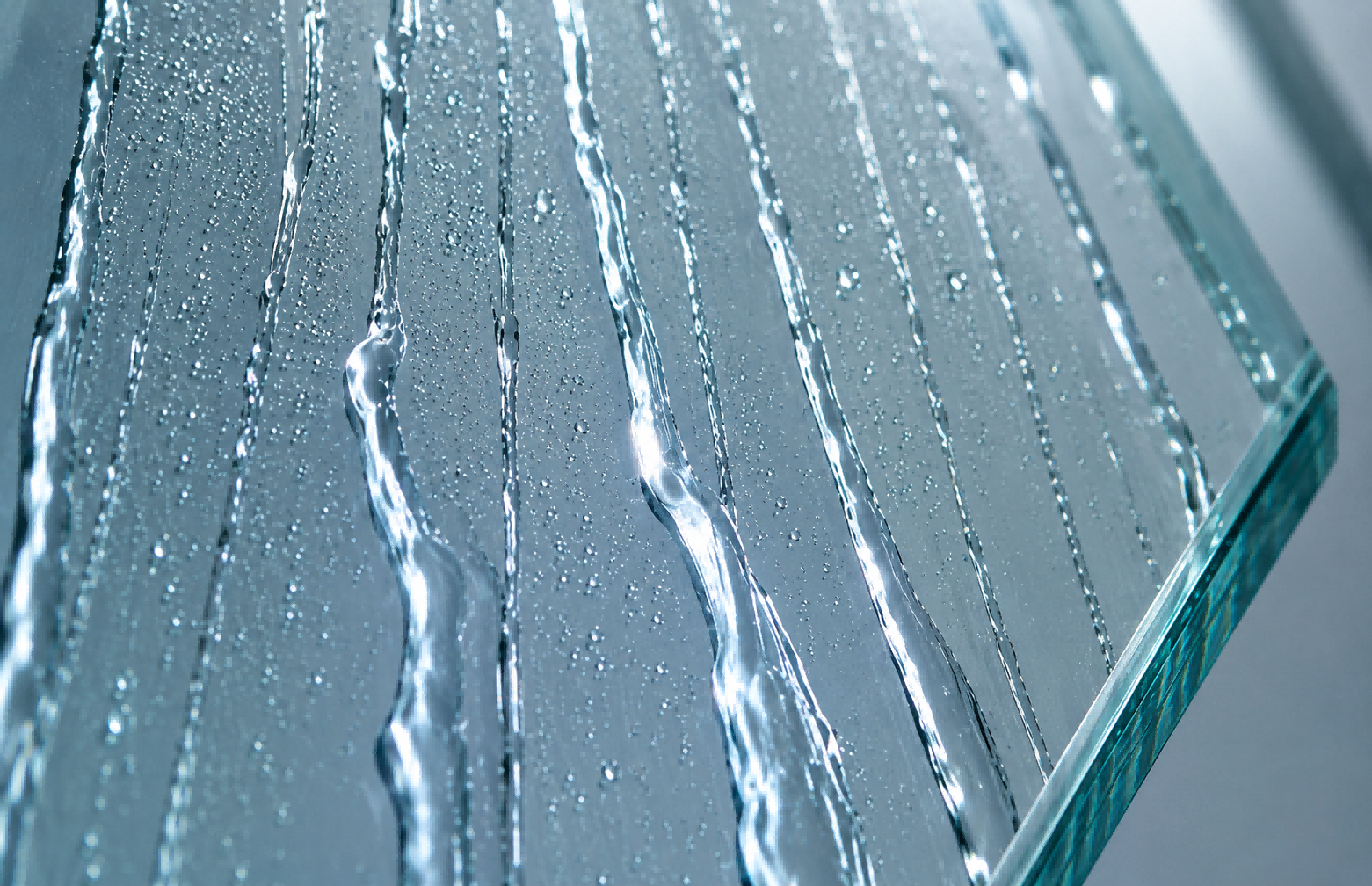 Hydrophobic (water-repellent) coating causes water to bead up with a high contact angle, allowing droplets to easily roll off and carry away dirt.