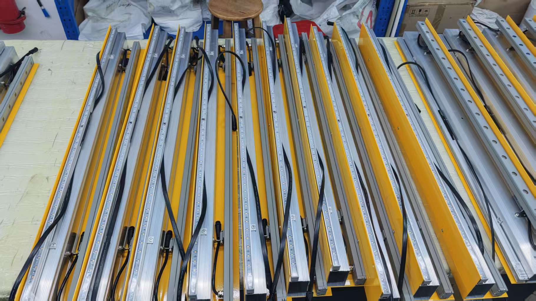 Custom wall washer and linear light fixtures in production batch for architectural facade lighting projects