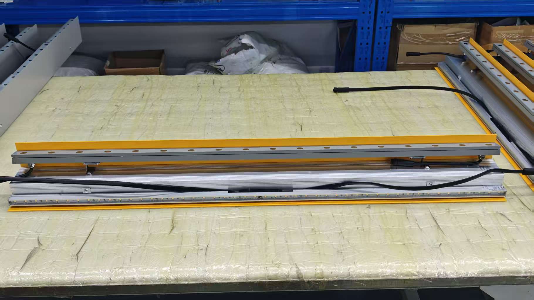 Custom dual-direction LED lighting system combining wall washer and linear light in one extrusion profile